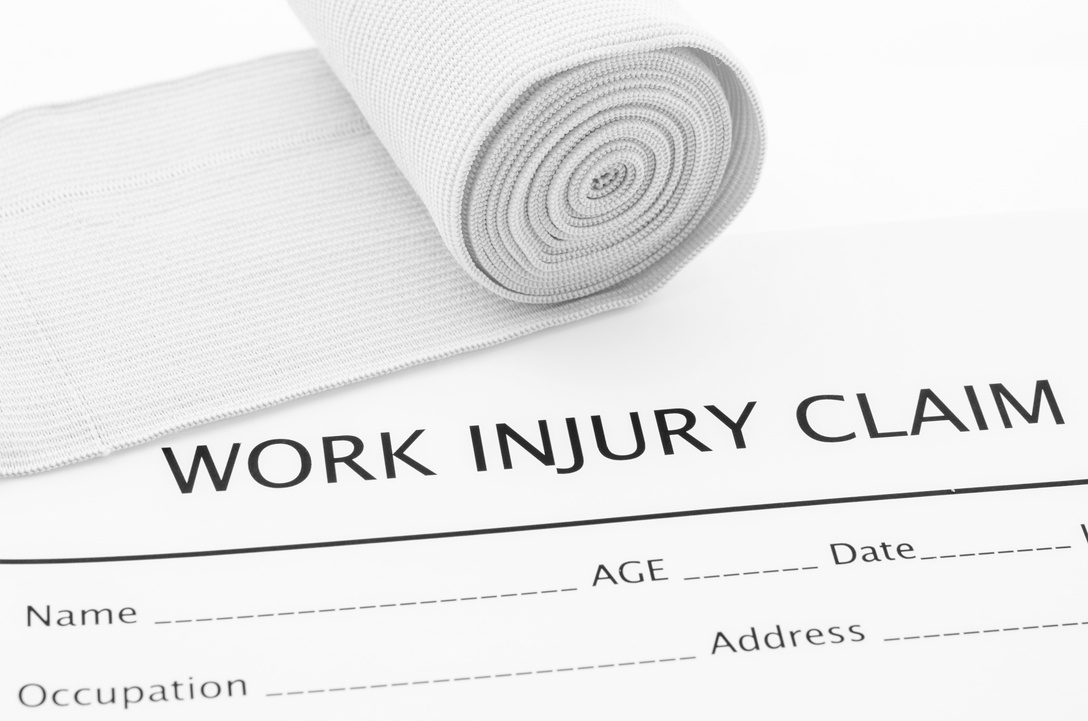 work injury claim form with bandage wrap