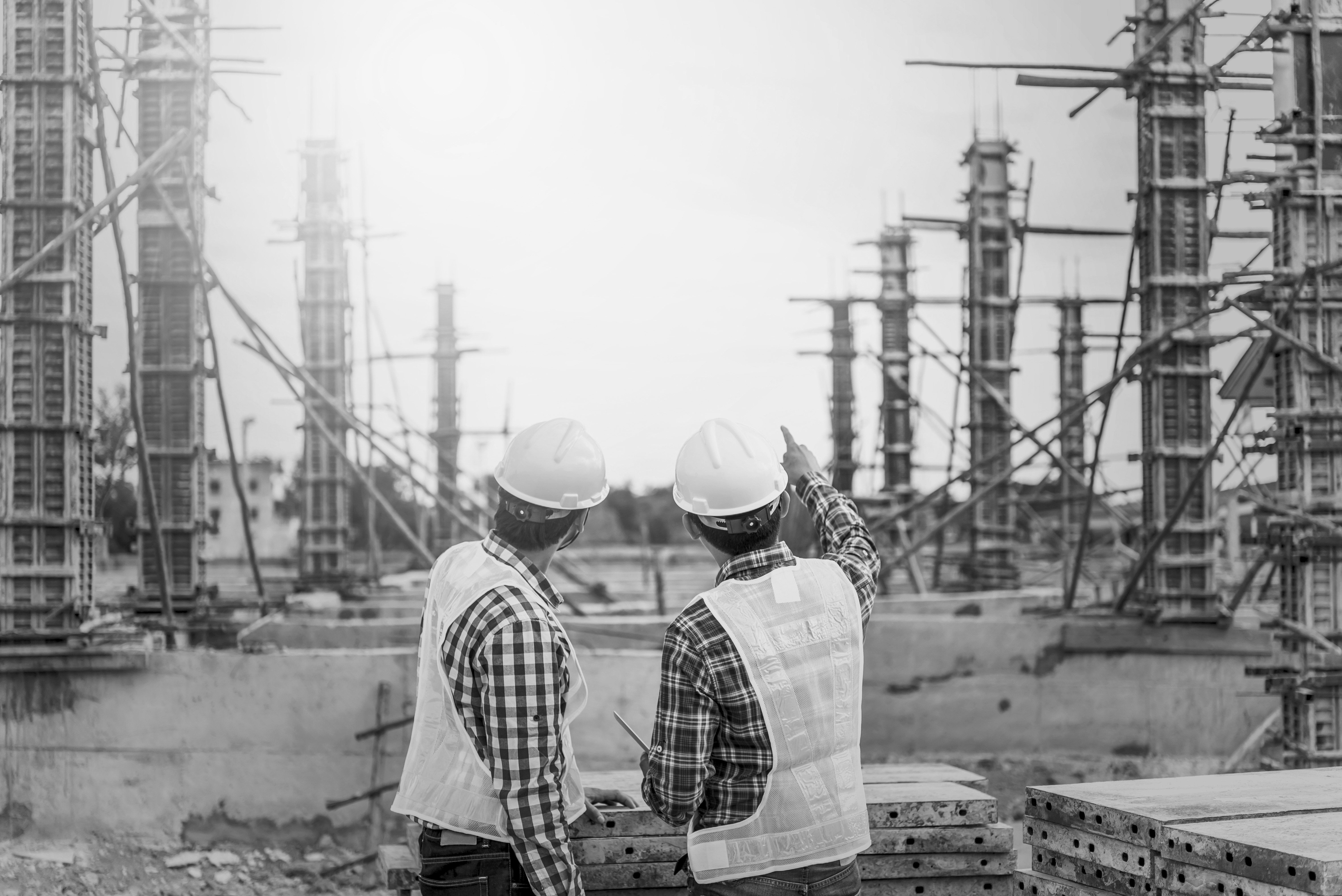 Two men on a construction site. 
