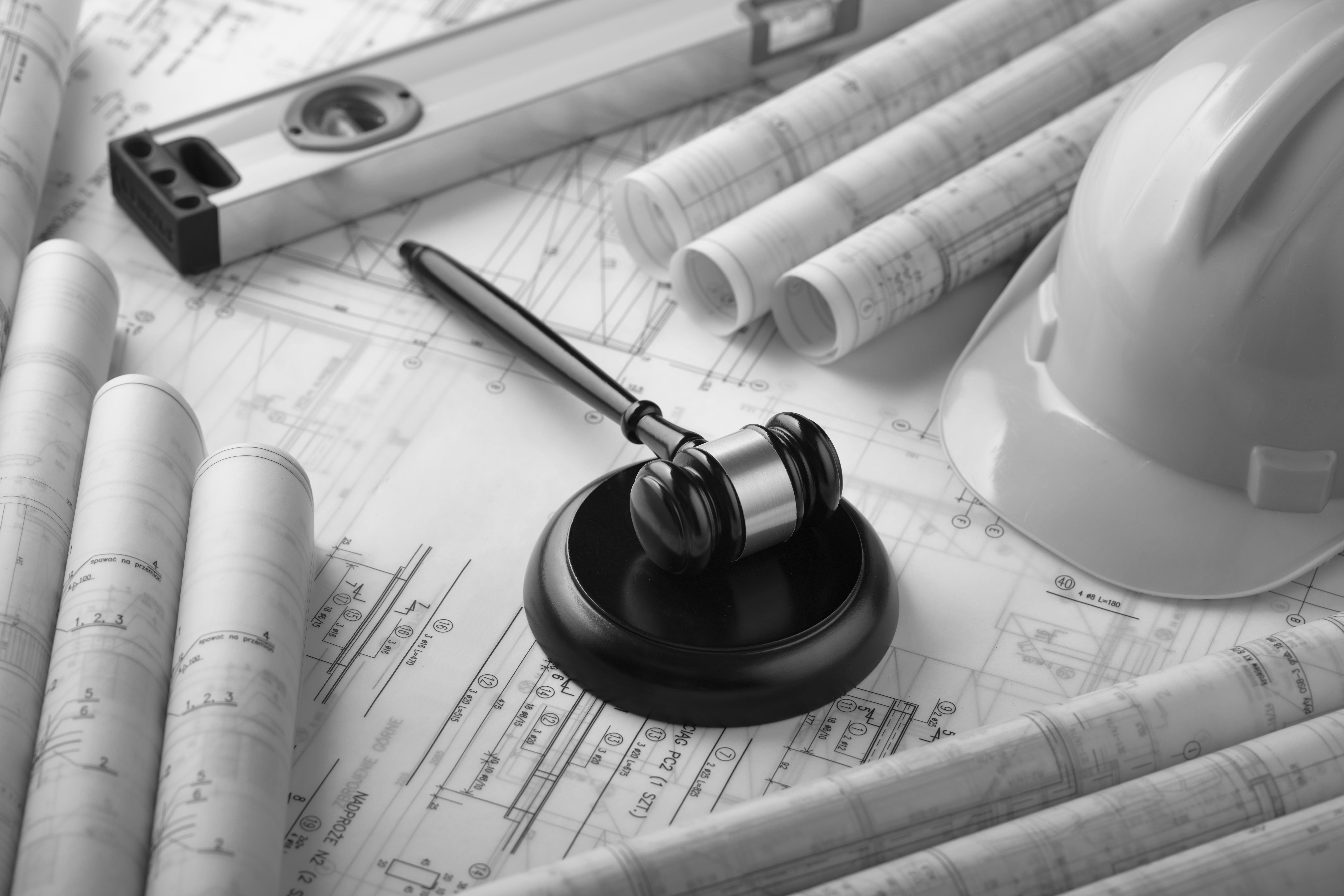 A gavel placed on top of construction plans